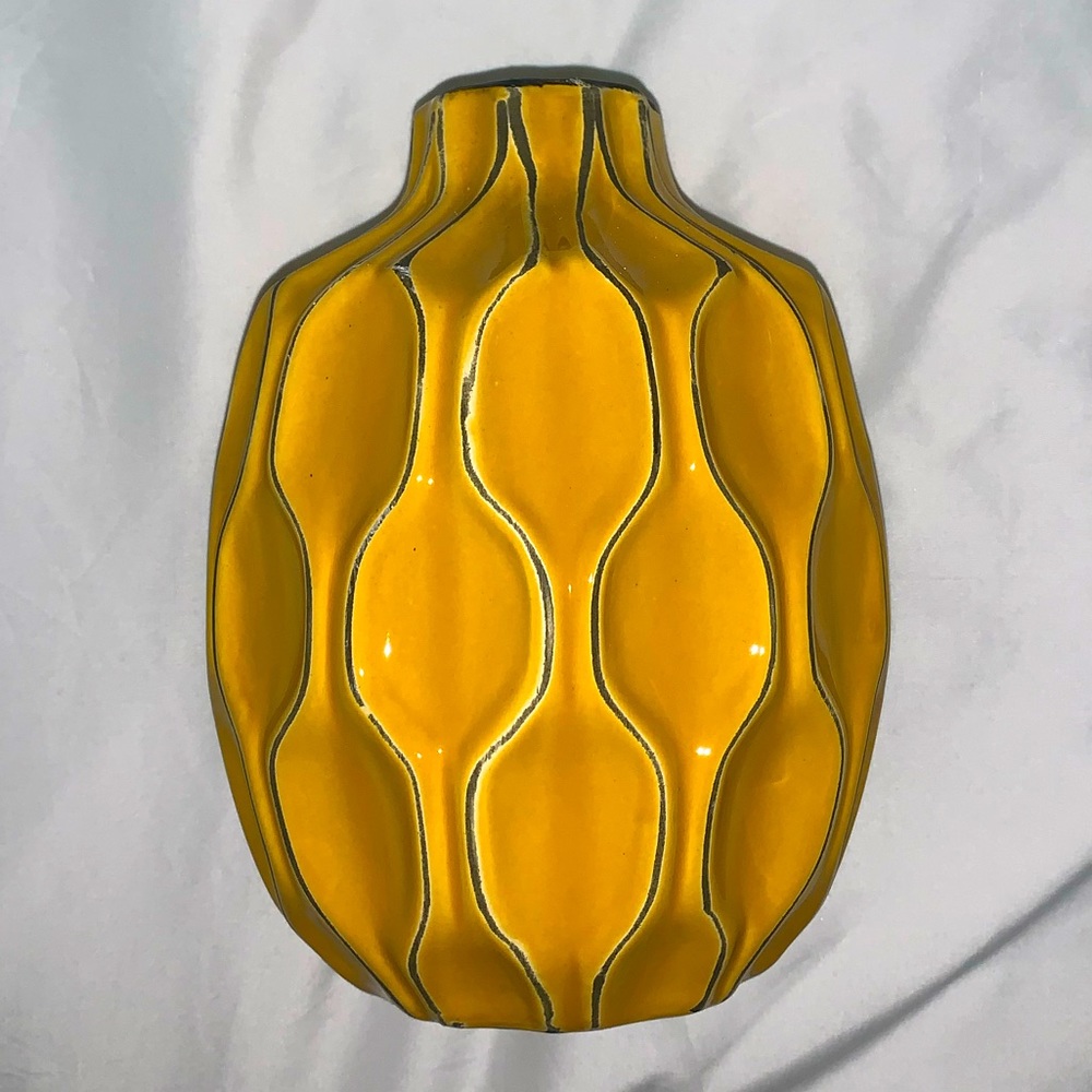 yellow vase with designs